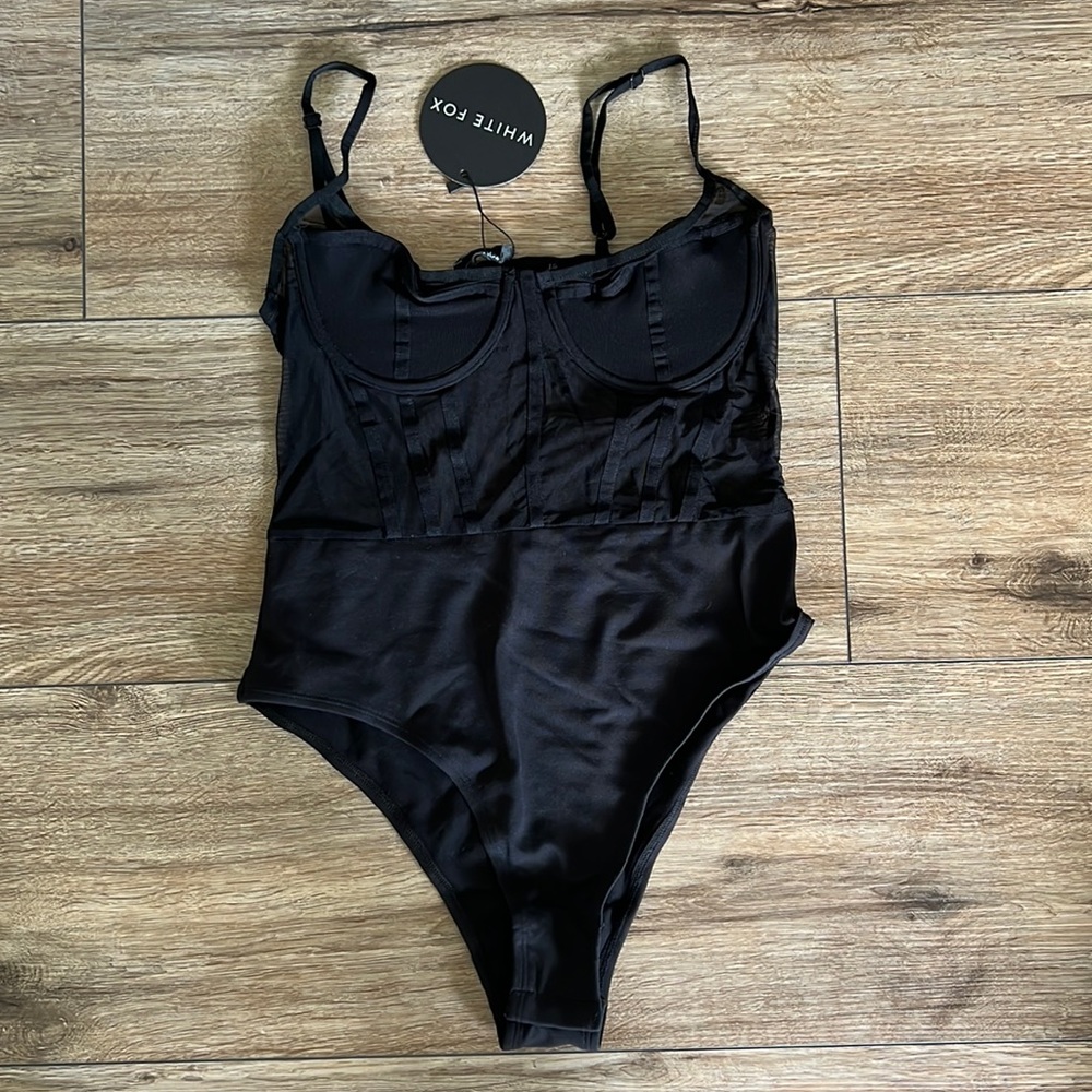 Black body suit with mesh cut out bustier top
